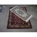 Traditional pattern acrylic rug, brown ground with central floral patterned field 107cm x 170cm