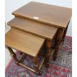 Nest of three oak rectangular occasional tables, turned supports with stretchers, max W49cm D33cm