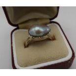 9ct gold hallmarked ring set with a single natural pearl, size P/Q