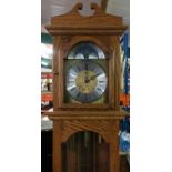 Hermle 8 day Westminster long case clock, in seasoned selected oak case, with triple weight driven