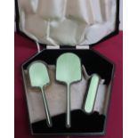Geo.VI silver and green enamel backed three piece dressing table set, Chester 1938, by Walker &