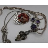 Silver necklace set with three amethysts, a marcasite pendant in the style of grape bunch, silver