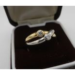 18ct two coloured gold, hallmarked, two stone diamond crossover ring, size M/N