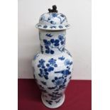 A large Japanese blue and white floor vase with floral pattern with various birds and insects,