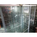 Three modern glazed display cabinets, each with three shelves, W43cm D37cm H162