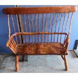 Country made rustic two seat bench, with solid top rail, stick back and shaped seat, on out-