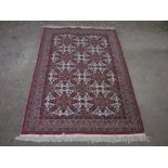 20th C Kayseri traditional Middle Eastern patterned rug, red ground with geometric patterned field