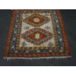 Chinese embossed washed woolen rug, old gold ground central floral medallion and floral pattern