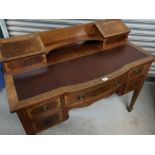 Carlton House style mahogany breakfront desk, with leather writing surface and five drawers, on