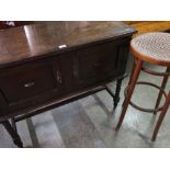 Early 20th C oak two door side cabinet, on barley twist supports joined by stretchers, W98cm D44cm