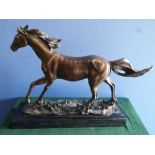After P.J. Mene (1810-1879), patinated bronze model of a galloping horse, on naturalistic base and