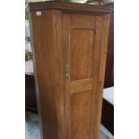 20th C oak hall wardrobe, with panel door enclosed by canted corners W71cm H177cm D33cm