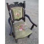 Victorian stained as rosewood open armchair, with carved top rail and needlework seat & back, on