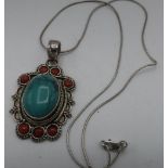 Continental white metal pendant set with cabochon turquoise and red stones, chain stamped 925