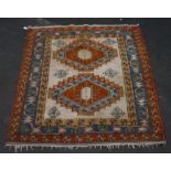 20th C Turkish style rug fawn ground with two central medallions ad geometric border and stars,