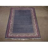 20th C traditional pattern rug, blue ground with beige and red geometric pattern border, 152cm x