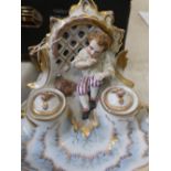 Late 19th C continental Rococo style ink stand, with two wells, modelled a young boy seated on a