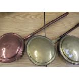 Copper warming pan and two other 19th C copper and brass warming pans (3)