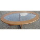 20th C teak finish oval coffee table with glass inset top, on square cross supports, L106cm W54cm