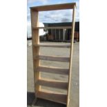Waxed pine five tier open bookcase on sledge supports, W80cm H203cm D28cm