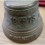 Vintage respirator, hand bell dated 1978, a small bell, and a copy of a Victory bell