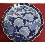 Japanese waved edge circular blue and white charger, all over decorated with chrysanthemums,