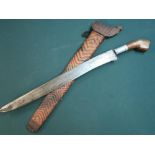 Indonesian style short sword with 18 inch single edged blade with various engraved markings, with
