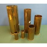 Selection of six various assorted shell casings of various sizes and calibre, including 105MM