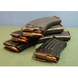 Group of four various assorted rifle magazines, each containing inert rounds