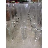 Set of fifteen tall wine glasses with trumpet bowls and knopped stems on tapering foot, H28cm