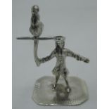 Silver figure of a pirate holding a parrot, stamp to base H.4.5cm