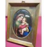 19th C oval hand painted porcelain plaque depicting a mother holding a child in brass easel frame,