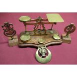 Early 20th C Warranted Accurate brass postage scales on shaped moulded base, with three brass