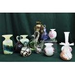 Collection of Mdina and other green, white and brown glassware including vases, swan and small