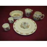 Collection of Royal Daulton Bunnikins ware including: childs dish, plate, two mugs and two egg cups