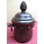 20th C mahogany biscuit barrel of cauldron form, twin handles and bee hive shaped finial