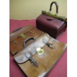 Continental burgundy leather Gladstone type bag with brass mounts and two vintage tan leather