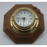 Robert Mouseman Thompson - a bulkhead type brass wall clock on octagonal backplate, carved with
