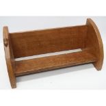 Robert Mouseman Thompson - an oak book trough, on curved end supports carved with signature mouse,