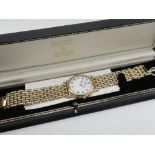 Raymond Weil quartz wristwatch with date. 18k gold plated case on matching rice grain bracelet, case