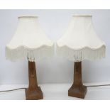Robert Mouseman Thompson - a pair of adzed oak octagonal table lamps, on leaf carved square bases