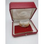 Ladies Cartier 18k gold Tank quartz wrist watch, textured Roman dial with diamond sides, case