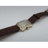 Longines mechanical wristwatch, rectangular wristed 10K gold filled case on leather strap. Snap on