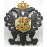 20th Century pierced and leaf carved softwood coat of arms, painted with Crown above rampant Lion,