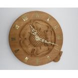Colin Beaverman Almack - a circular oak wall clock with a central carved Yorkshire Rose and brass