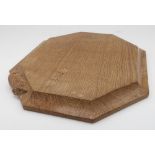 Robert Mouseman Thompson - an adzed oak bread board, carved with signature mouse, W30.5cm D25cm