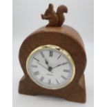Trevor Squirrelman Hutchinson - an adzed oak mantel clock, with quartz movement in arched case, with