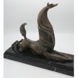 French School (20th Century): Art Deco study of a seated styalised Hound, patinated bronze on