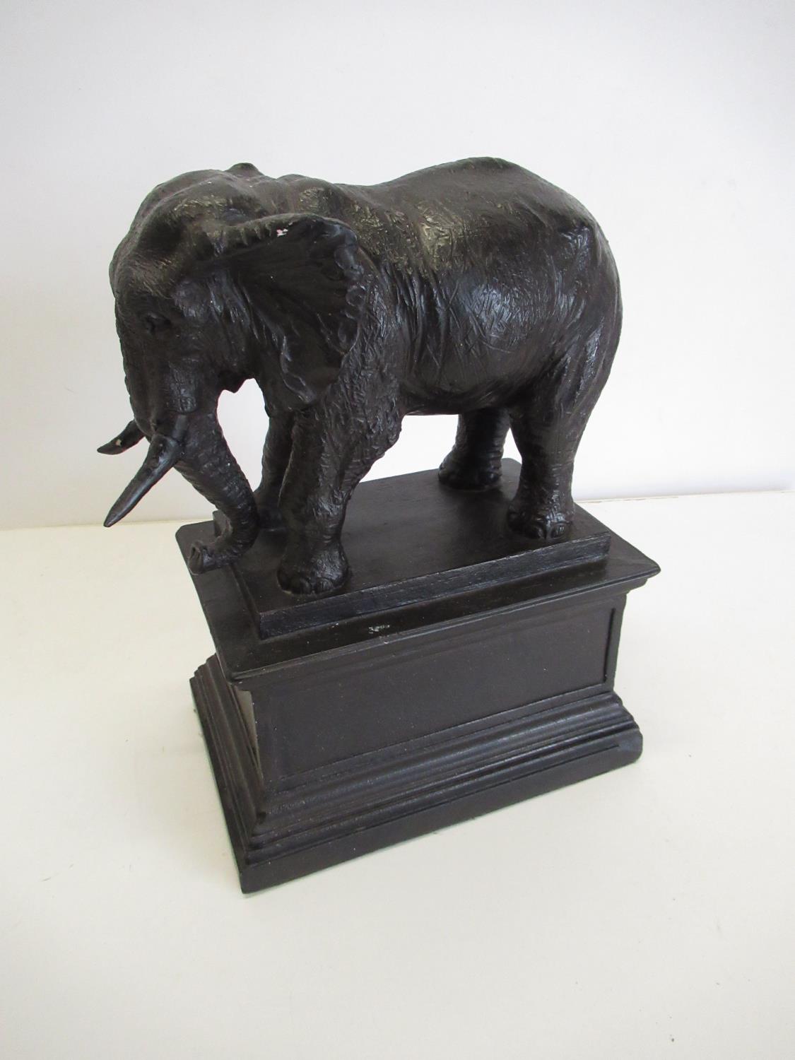 Cast statue of an elephant on a plinth H.33cm