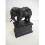 Cast statue of an elephant on a plinth H.33cm